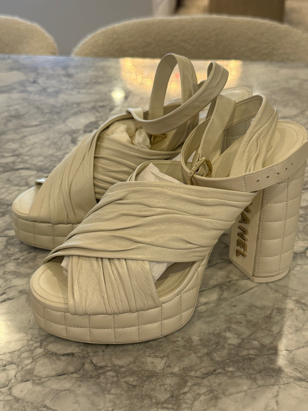 Ivory lambskin Chanel platform sandals with the quilted platform and block heel