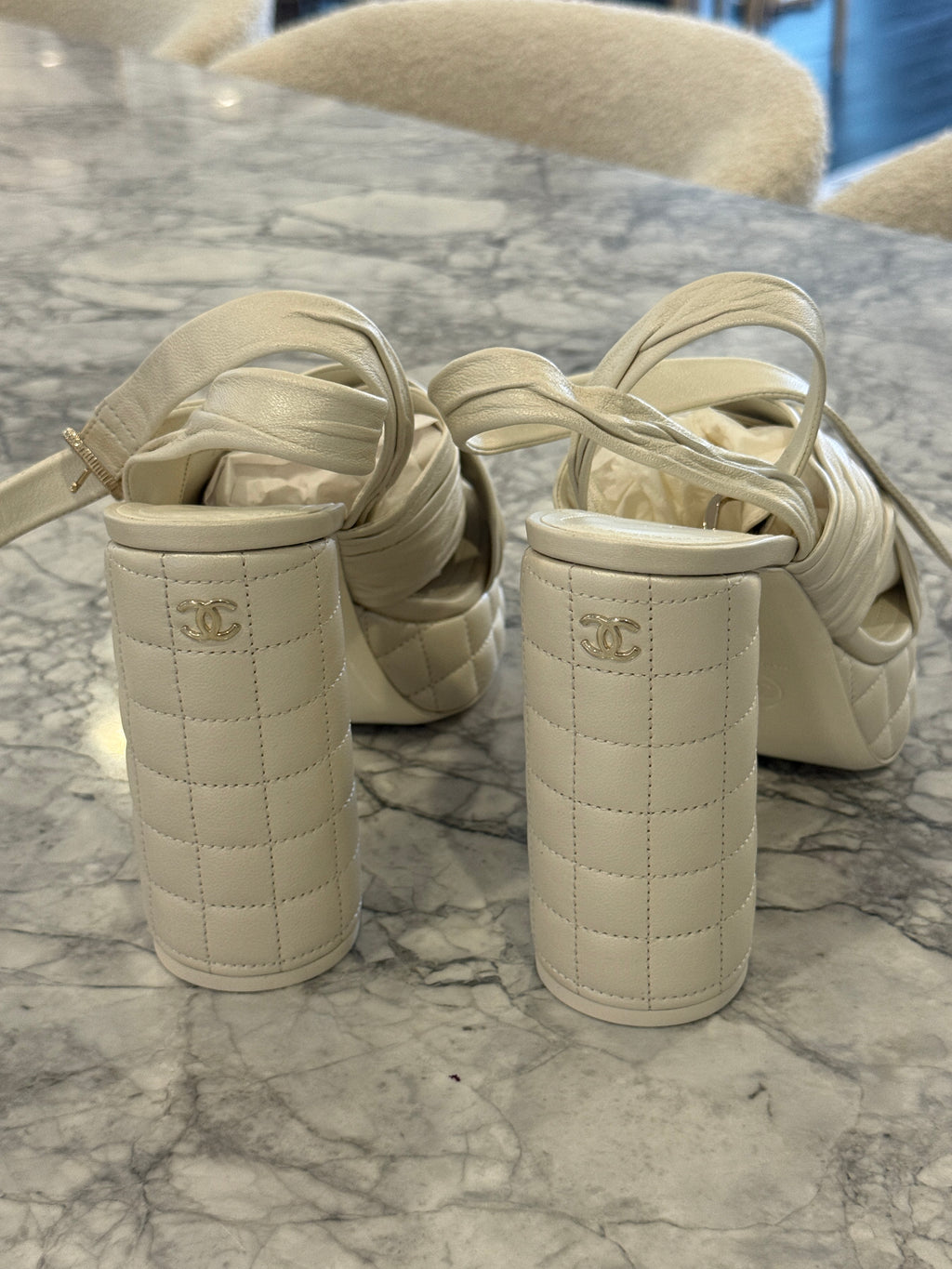 Ivory lambskin Chanel platform sandals with the quilted platform and block heel