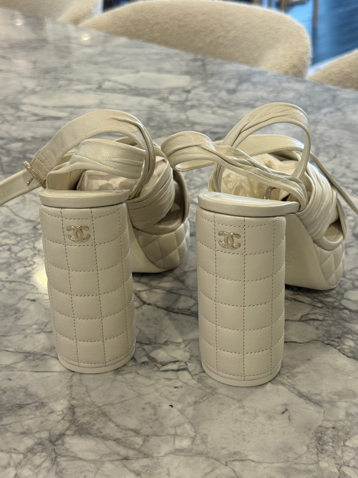 Ivory lambskin Chanel platform sandals with the quilted platform and block heel