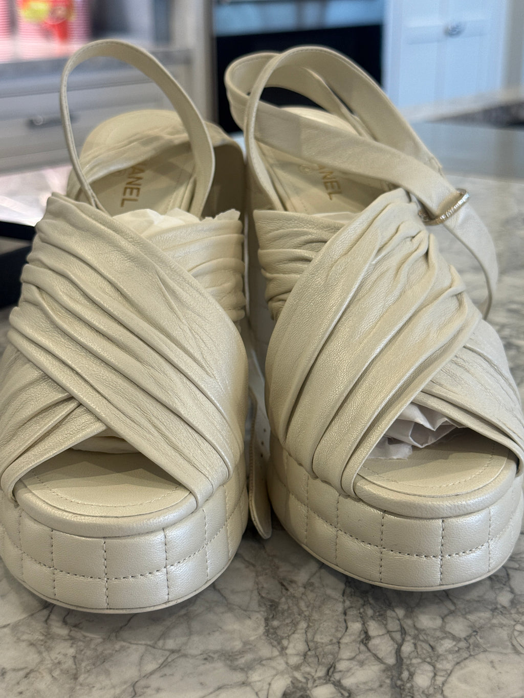 Ivory lambskin Chanel platform sandals with the quilted platform and block heel